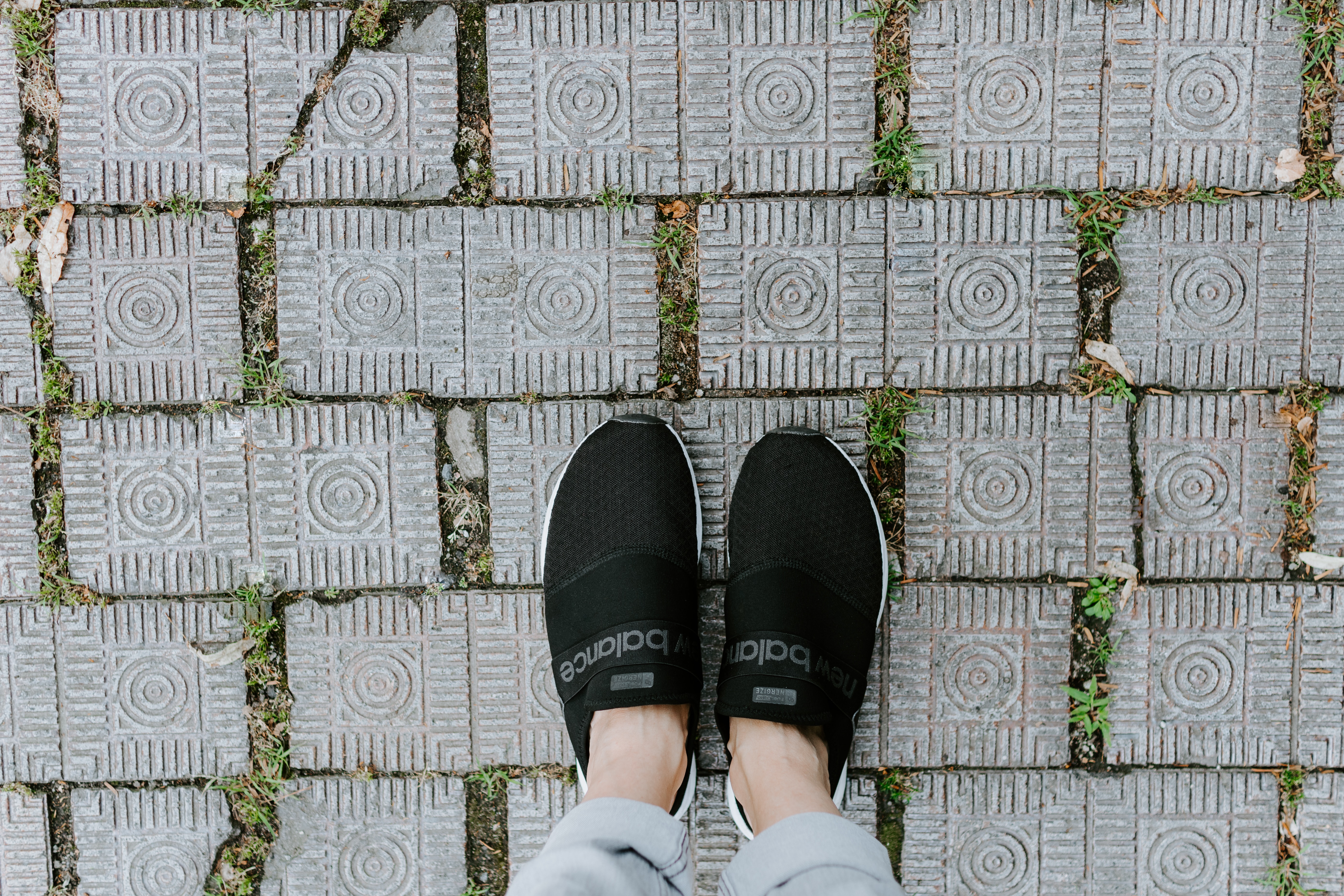New balance shoes on decorative concrete tiles