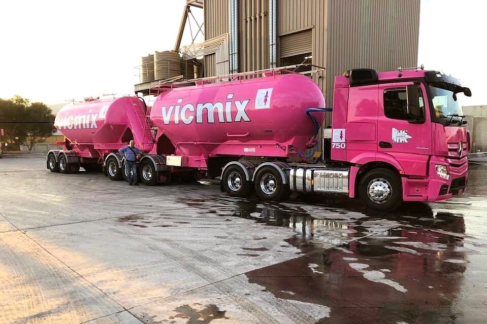 Bright pink Vicmix tanker under warm sunlight